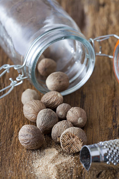 istock Nutmegs spice in glass 177084739