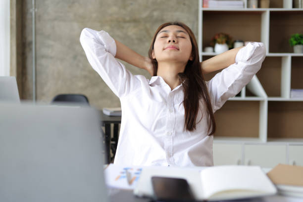 istock Lazy woman stretching to relax during break time in office. 1770848288