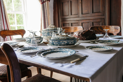 Traditional table setting in the dining house of an old farmhouse