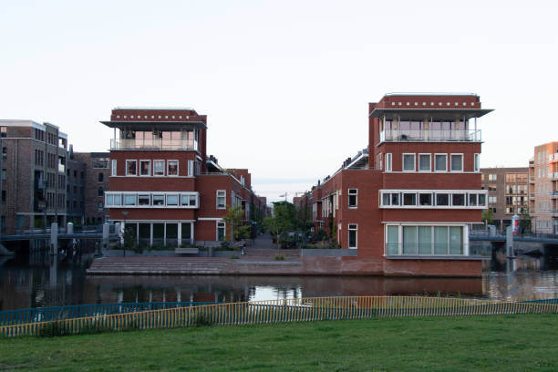istock Typical Amsterdam living on the water. Square prefabs with large windows in red. Amsterdam, Netherlands 1770864201