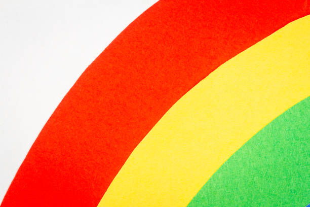 Multicolor background from a paper of different colors. Abstract colorful vibrant paper textures.