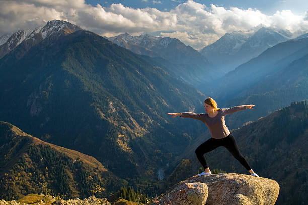 istock Young women doing yoga at summit 177089700