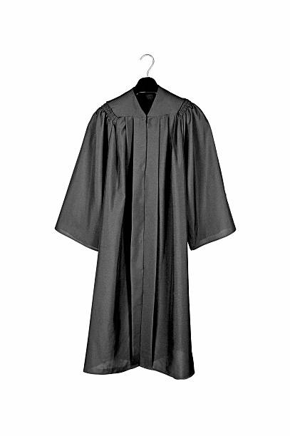 black graduation gown - toga stockfoto's en -beelden
