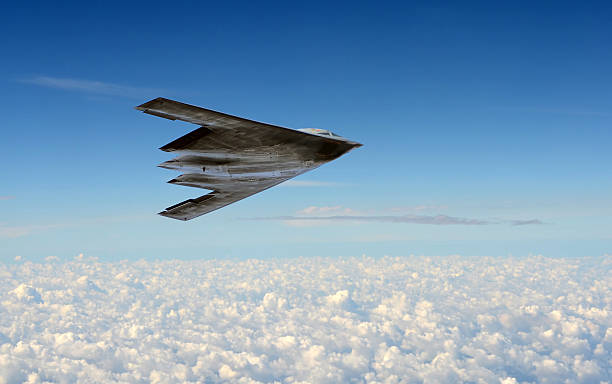 Stealth bomber in flight Modern stealth bomber flying at high altitude stealth stock pictures, royalty-free photos & images
