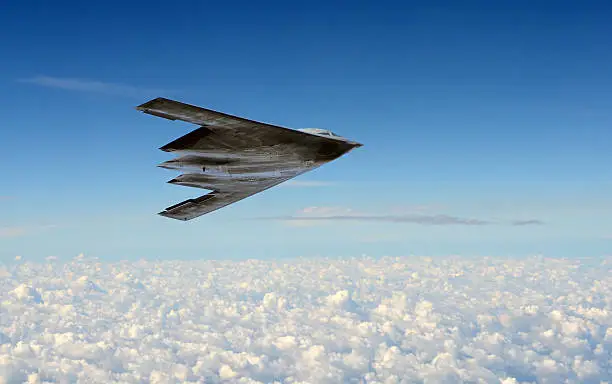 Modern stealth bomber flying at high altitude