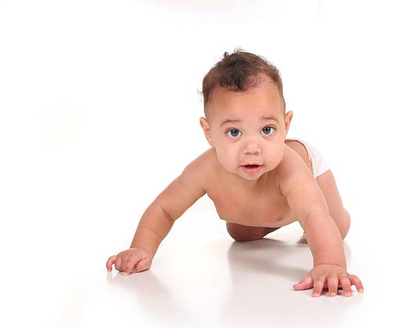 istock Baby Boy Learning to Crawl on White 177091450