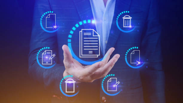 istock Businessman holding multimedia type of modern buttons with virtual background, Document Management System (DMS), searching and managing corporate files information. 1770919981