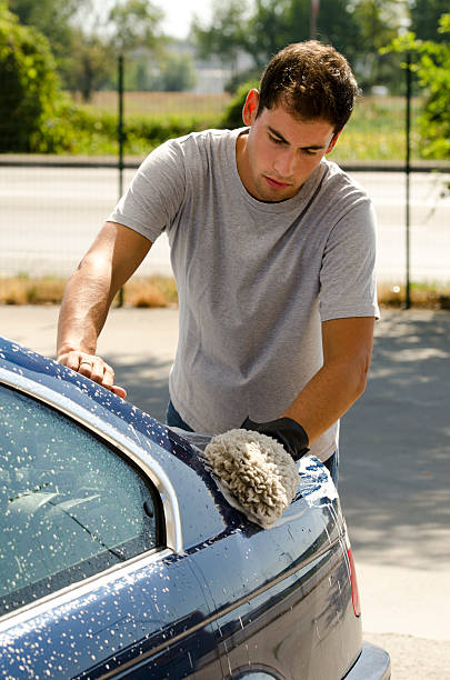 istock Young Man Cleaning A Car With Sponge 177092536