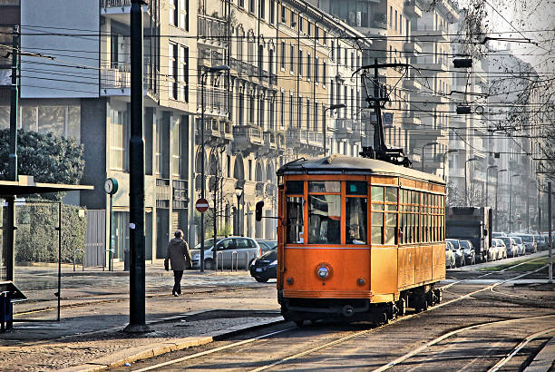 alte vintage orange straßenbahn in mailand - milan italy cable car old italy stock-fotos und bilder