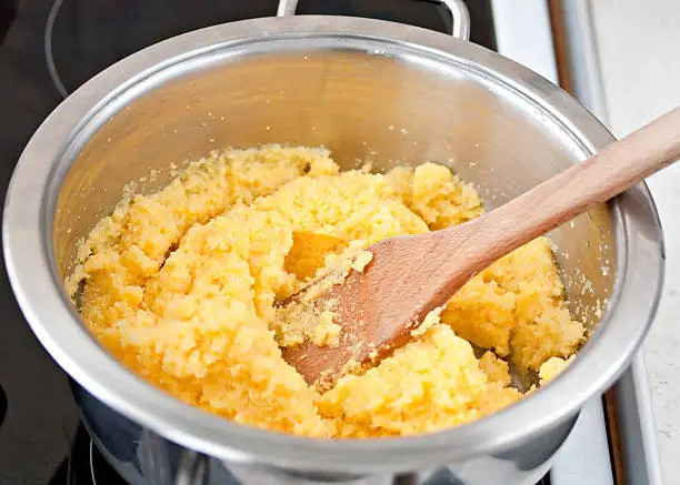 polenta corn traditional food cooking in dish