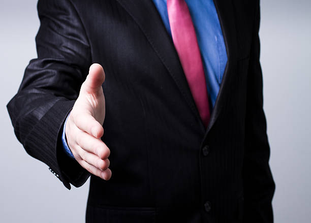 istock businessman offering to shake your hand 177092935
