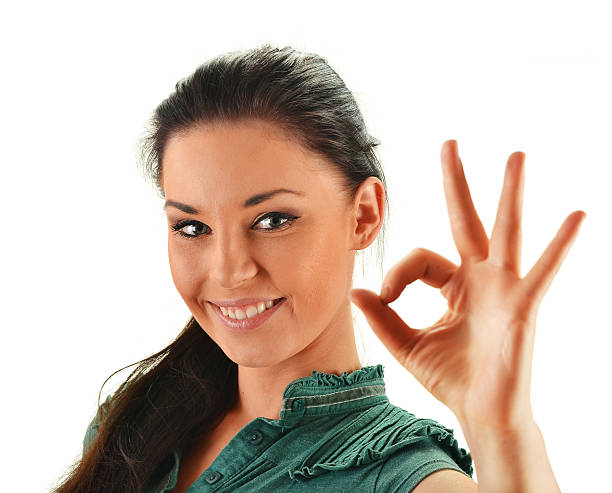 istock Young attractive woman showing ok isolated on white 177094174