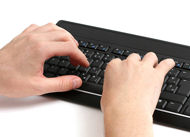 Mãos no teclado - fotografia de stock