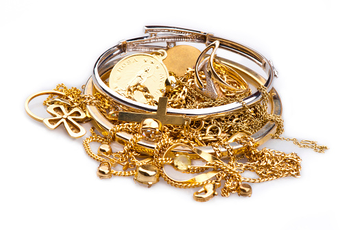 Pile of Gold Jewelry on a white background