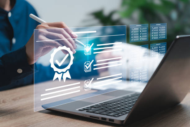 istock Online exam tests document measure results and knowledge levels, Certificate standard documents, Businesswomen use a laptop to study through the website online, Upskill learning for making exam tests 1770954311