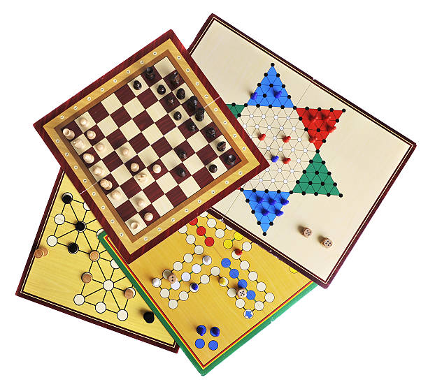 Board games "Various board games of ludo, halma, chess and fox and geese isolated on white" chinese checkers stock pictures, royalty-free photos & images