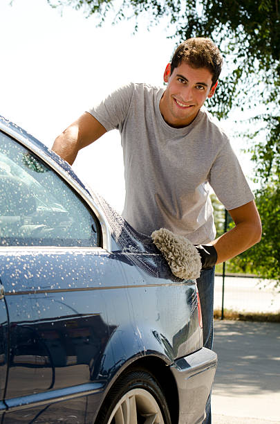istock Young Man Cleaning A Car With Sponge 177095723