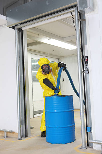 istock professional filling large blue barrel with chemicals 177096008