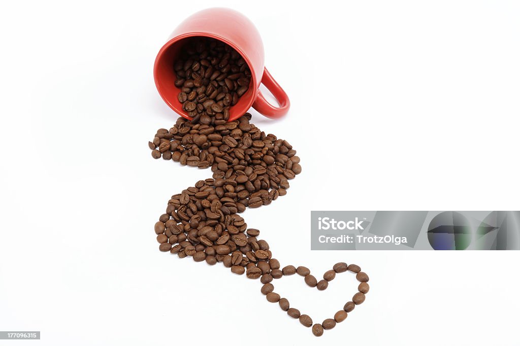 Heart of the coffee beans from an overturned cup. Brown Stock Photo
