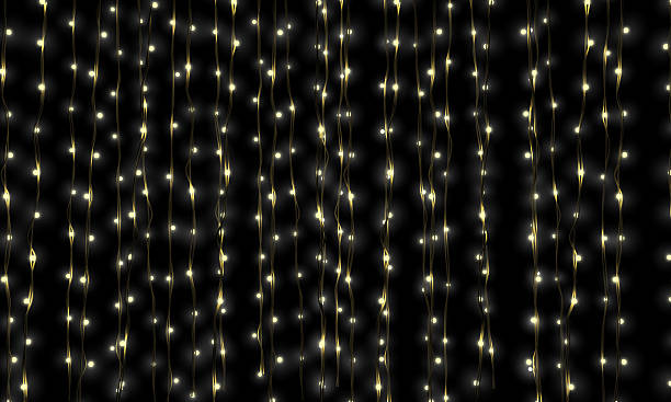 Fairy Light Cascade A curtain of illuminated fairy lights chord stock pictures, royalty-free photos & images