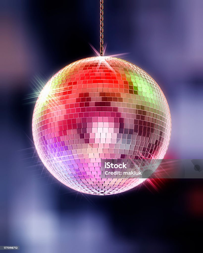 Disco ball with highlights and out of focus background disco ball, symbol of party Disco Ball Stock Photo