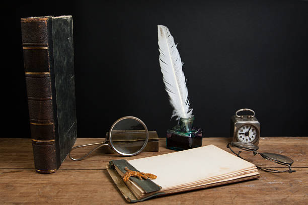 istock Vintage quill and inkwell, notepad, book, magnifying glass, clock, spectacles 177098886