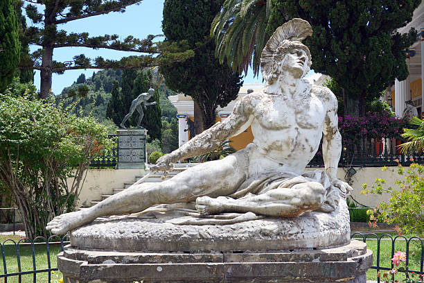 Wounded Achilles "Sculpture of the wounded Achilles in garden of Achilleon palace on Corfu island, Greece" corfu holiday palace stock pictures, royalty-free photos & images