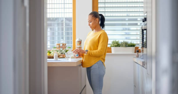 istock Woman holding pill bottle 1770997645