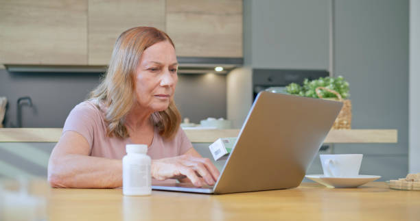 istock Woman holding pill bottle 1770997646