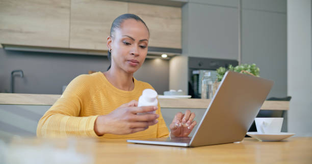 istock Woman holding pill bottle 1770997655