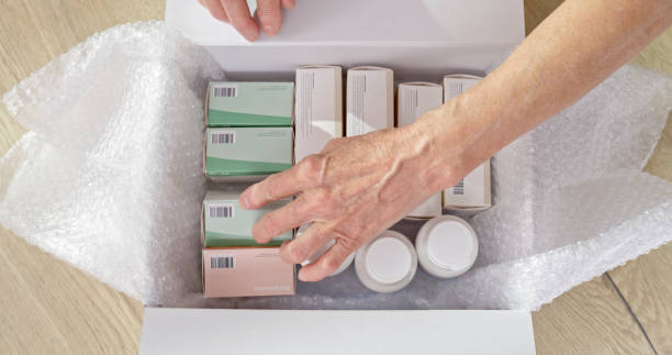 Woman opening pharmacy box