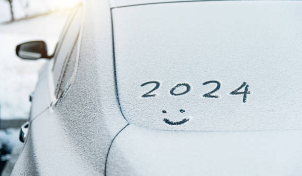 istock New year 2024 and smiling face written on car windshield 1771000311