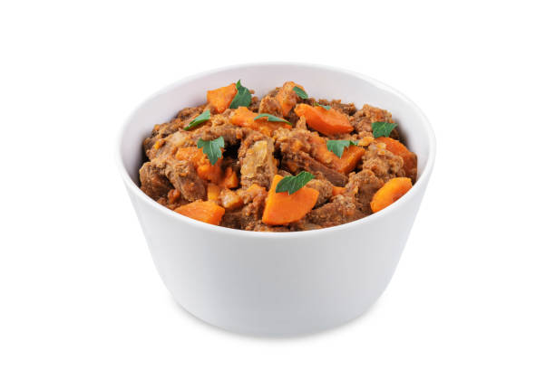 Beef stew in a bowl on a white isolated background