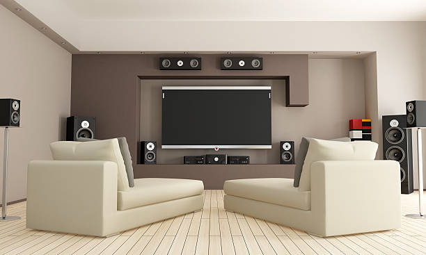 Home cinema room with two lounge chairs elegant living room with home theatre system - rendering entertainment center stock pictures, royalty-free photos & images