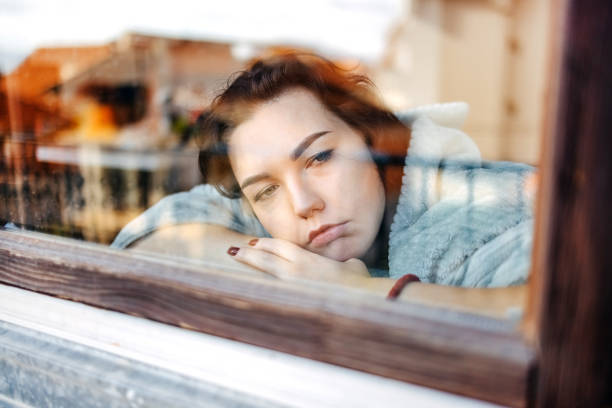 istock Young depressed woman home alone looking sad 1771013722
