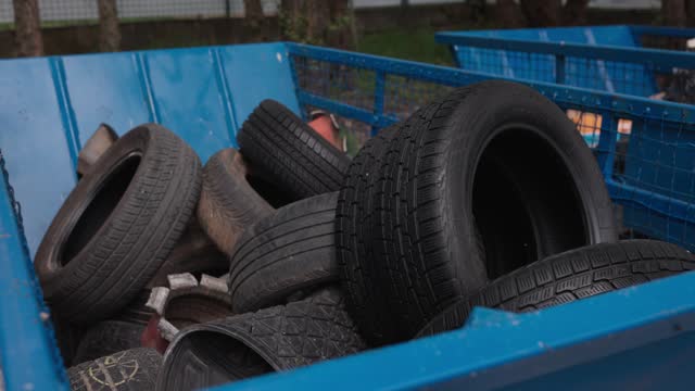 Bunch of rubber tires in container