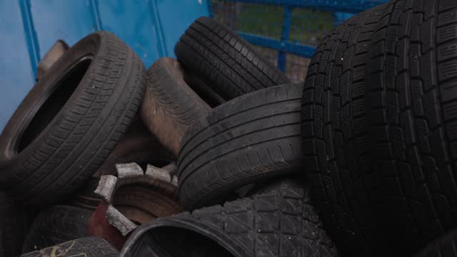 Bunch of rubber tires in container