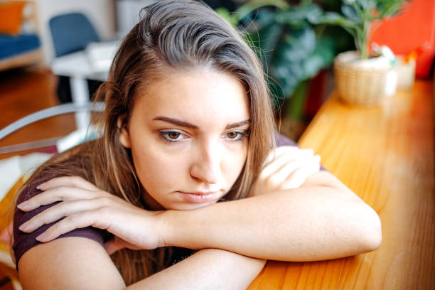 istock Young depressed woman home alone looking sad 1771015930
