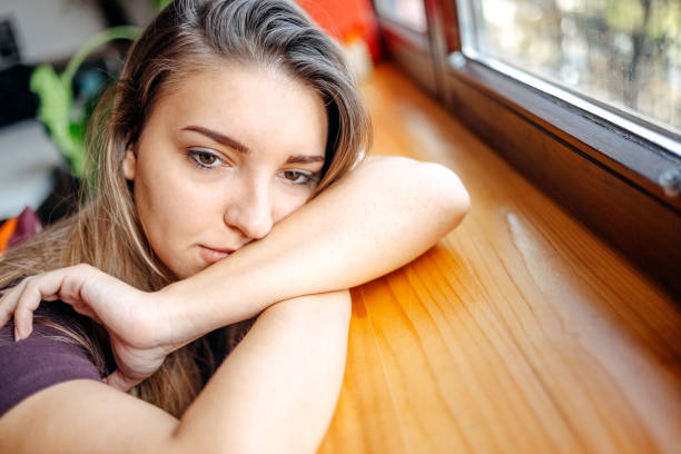 istock Young depressed woman home alone looking sad 1771016450