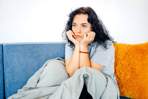 istock Young depressed woman home alone 1771016455