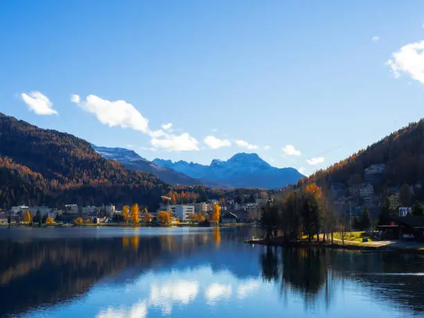 Magnificent autumn atmosphere of St.Moritz, famous and luxury ski resort town, located in the upper Engadin valley in the south-eastern corner of Switzerland. View of St.Moritz lake and luxury resorts