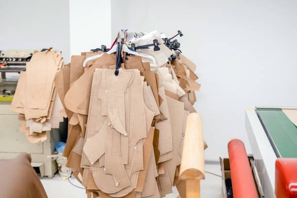istock Paper sewing patterns for clothes in sewing factory. Clothing pattern, manufacture on sewing factory 1771017018