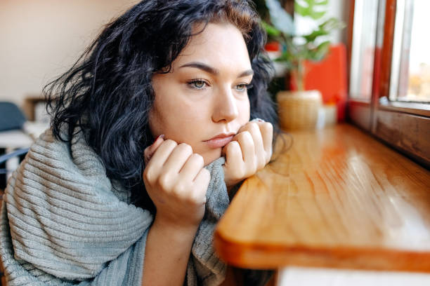 istock Young depressed woman home alone looking sad 1771018075