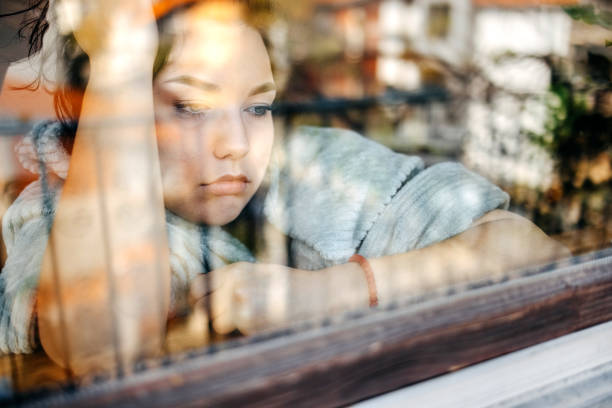istock Young depressed woman home alone looking sad 1771018078