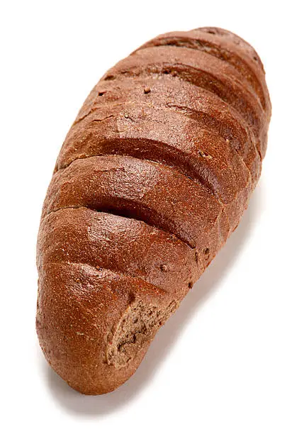 Black bread loaf closeup on white background