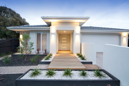 Facade and entry to a contemporary white rendered home in Australia.