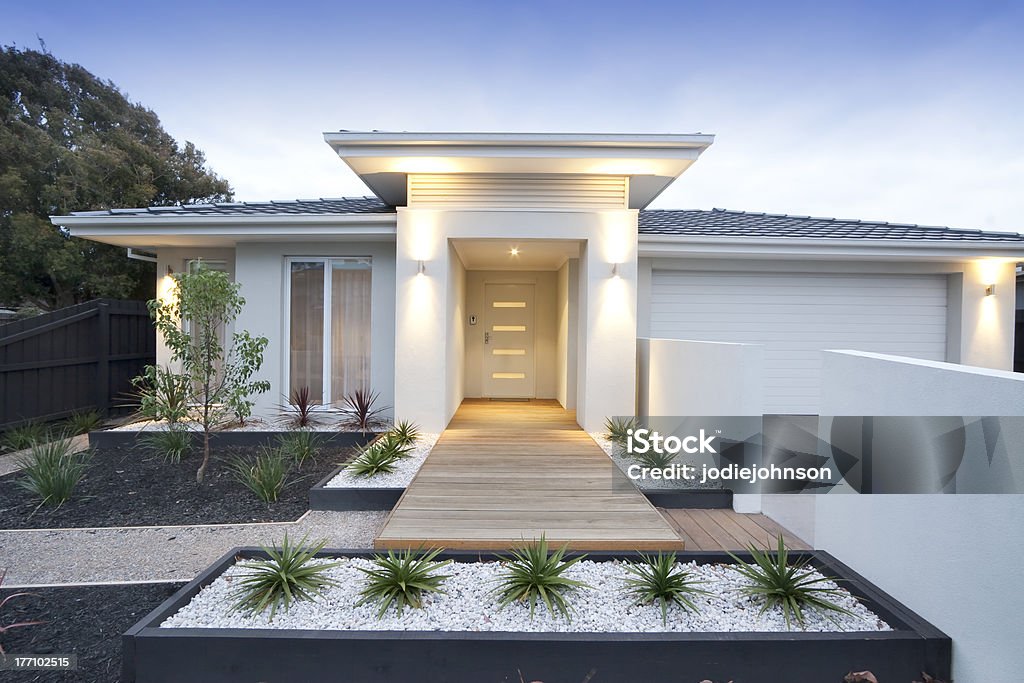 Front view of contemporary home in Australia Facade and entry to a contemporary white rendered home in Australia. House Stock Photo