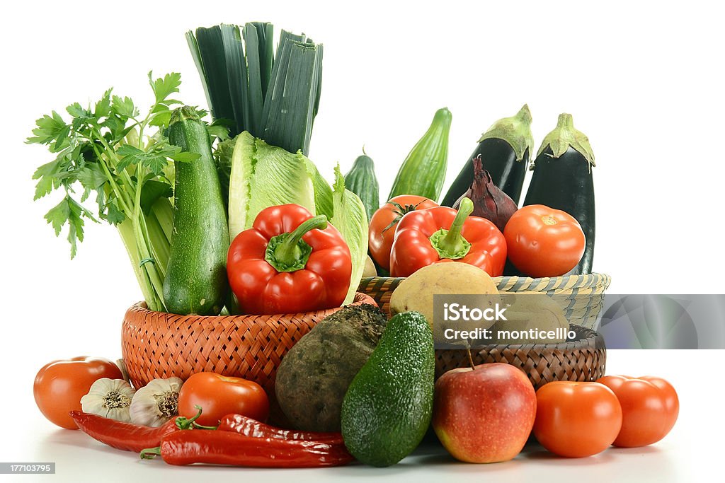 Composition with raw vegetables in baskets Composition with raw vegetables in baskets isolated on white Antioxidant Stock Photo
