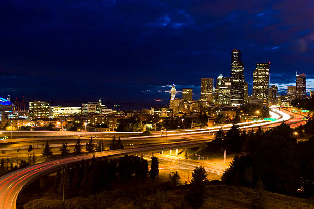 istock Seattle skyline at night and traffic light trails 177104112
