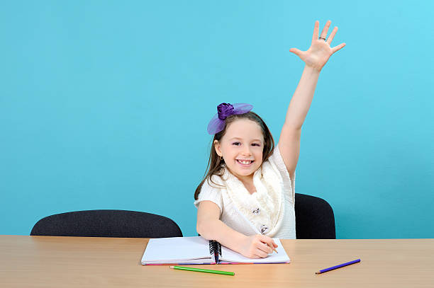 istock Happy school girl in classroom 177104422